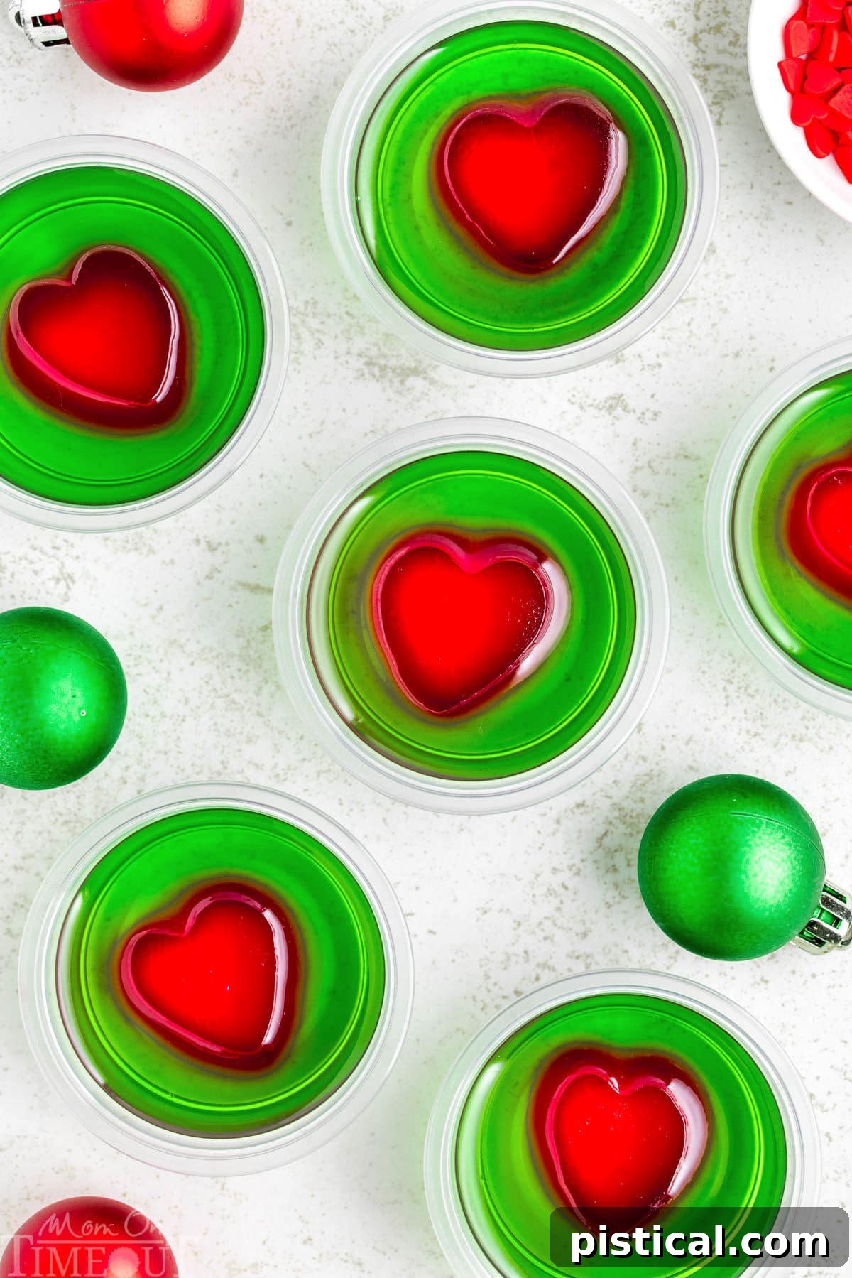 A top down view of a bunch of grinch shots on a white surface.