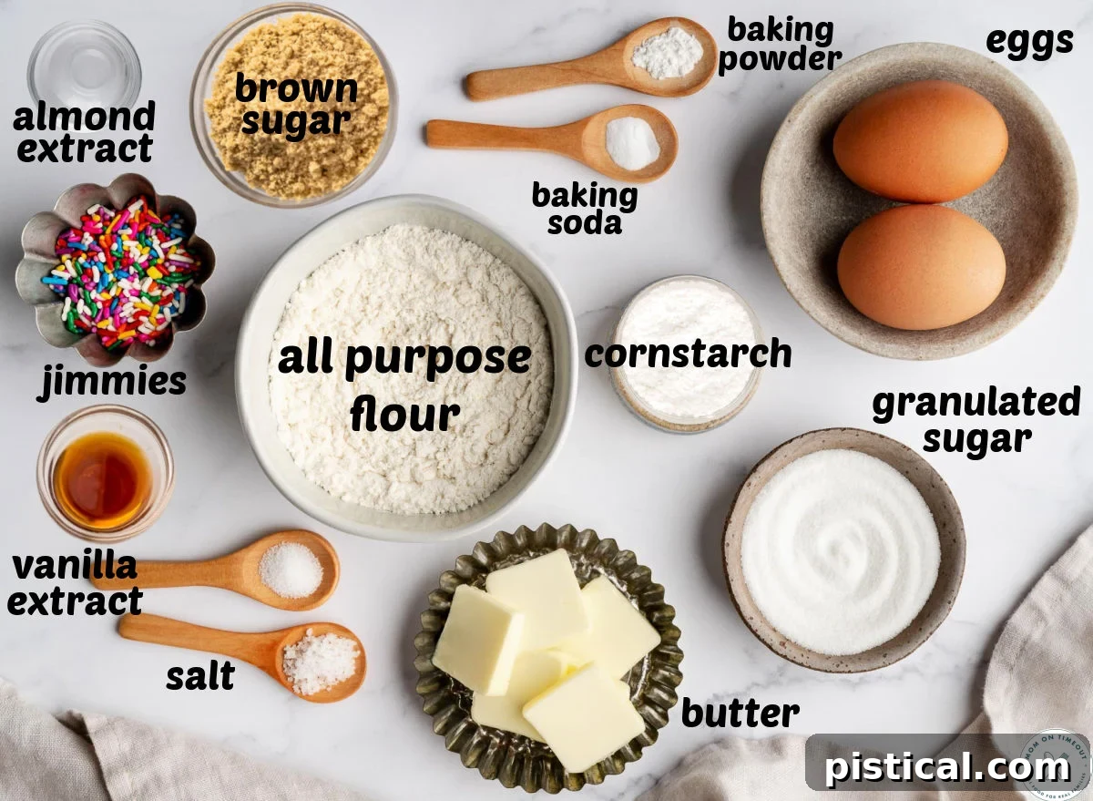 Overhead shot of sprinkle cookie ingredients measured into small bowls and labeled.