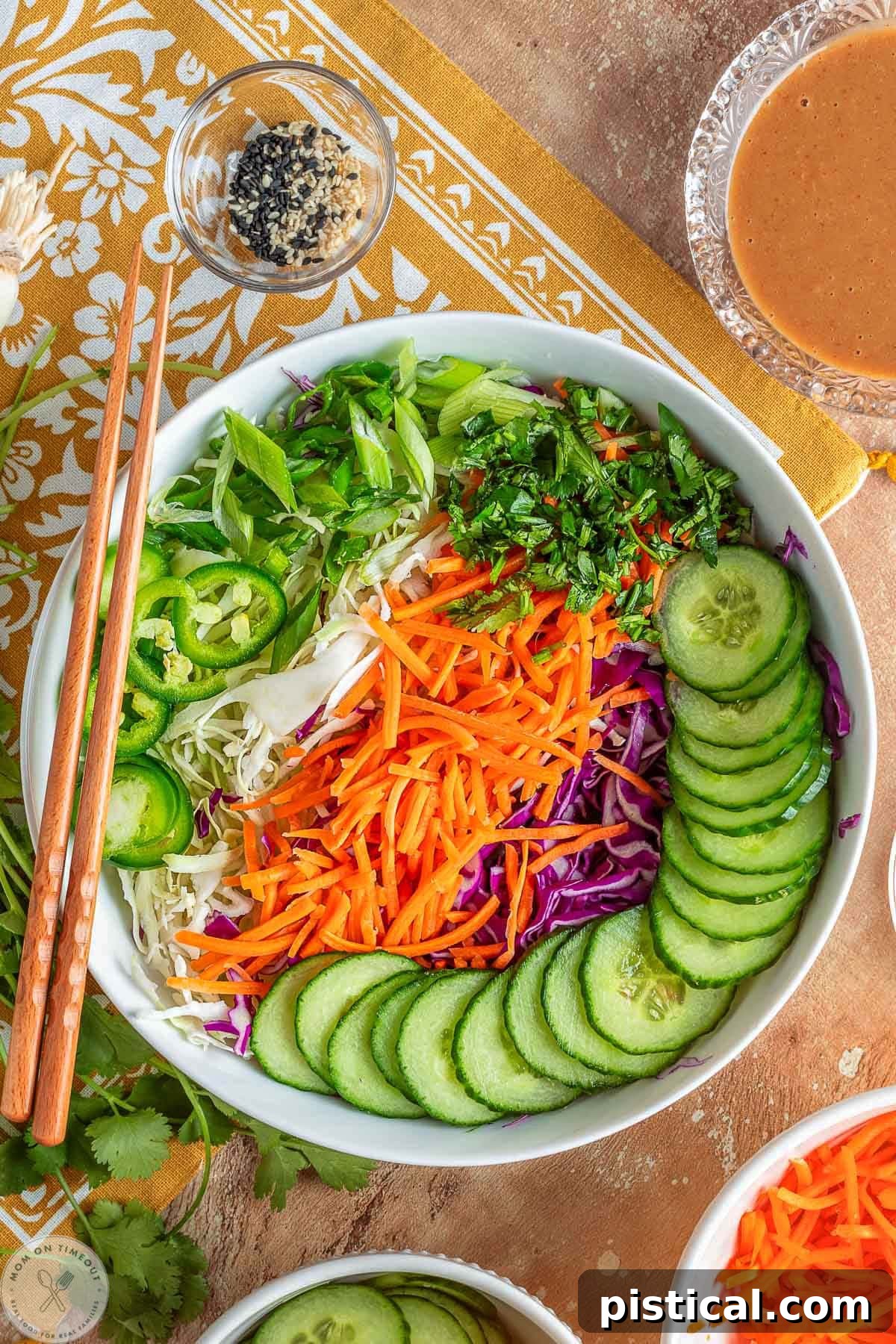 Thai salad ingredients laid out in white bowl.