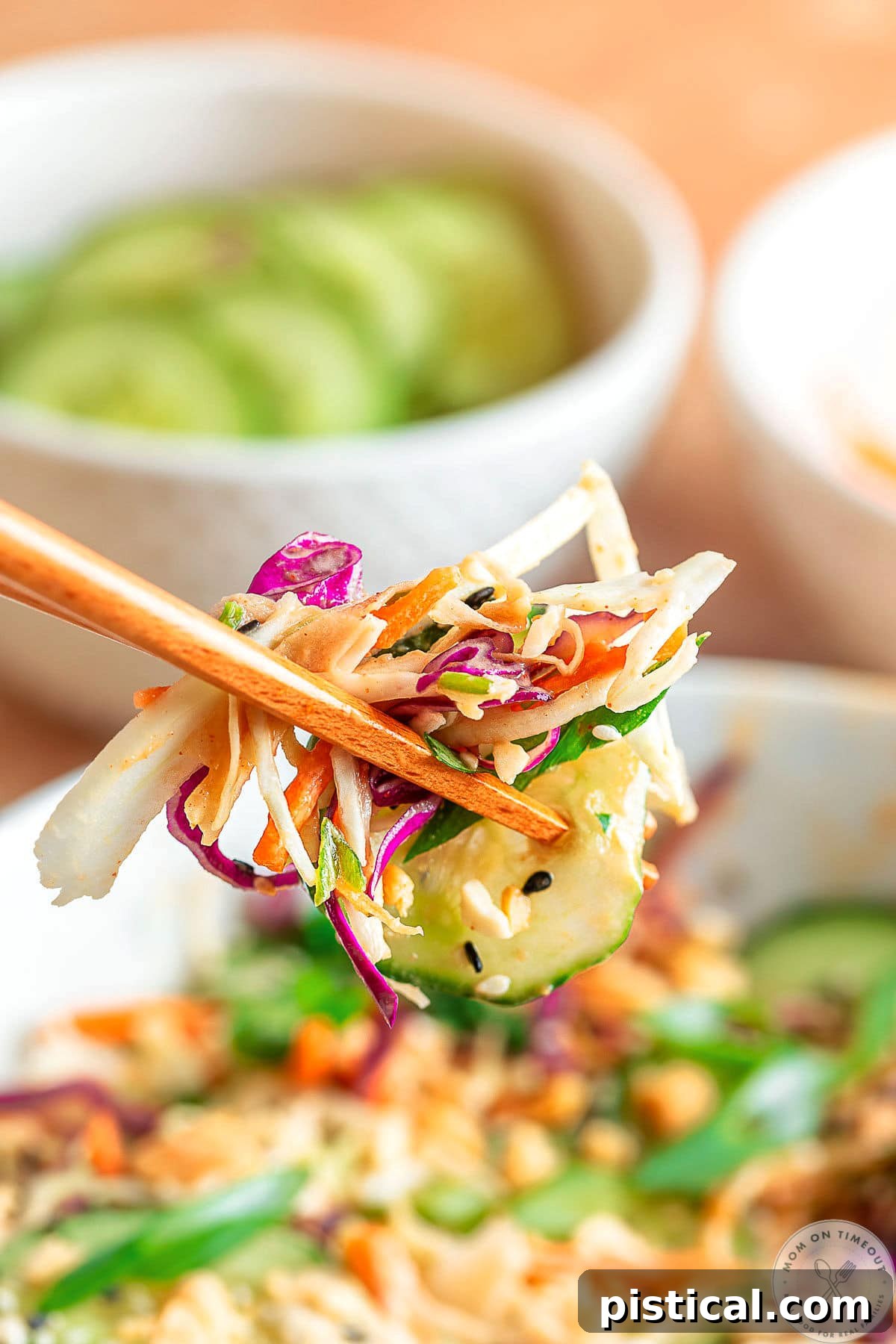 Thai salad recipe being eaten with chopsticks.